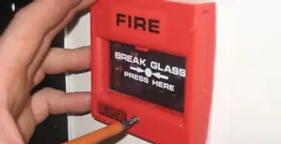 fire alarm installation service showing manual fire alarm pull station installed by licensed electricians in New Orleans, LA