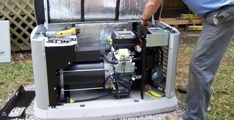 generator installation service showing technician connecting and configuring generator components in New Orleans, LA
