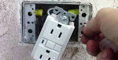 gfci circuits service showing installation of a ground fault circuit interrupter outlet by licensed electricians in New Orleans, LA