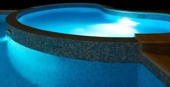 pool light installation and repair services highlighting illuminated pool interior lighting in New Orleans, LA