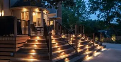 Residential electrician installing outdoor lighting for home safety in New Orleans, LA