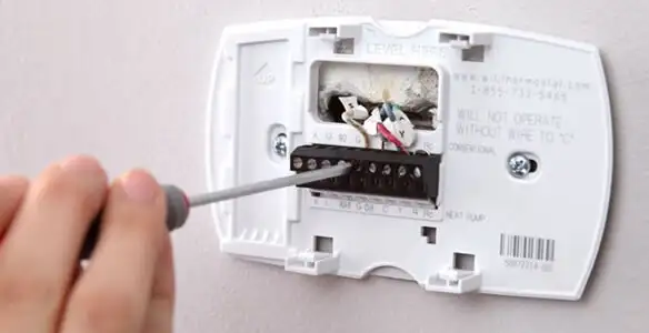 Thermostat installation service with proper wiring and secure wall mounting in New Orleans, LA